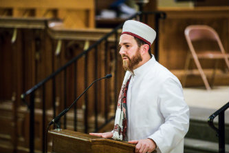 Walead Mossad leads a Muslim service following a campus vigil for the New Zealand mass shooting victims.