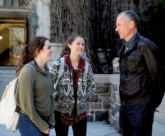 Siobhan ’19 and Anna ’17, talk with their dad, Tom Gillis.