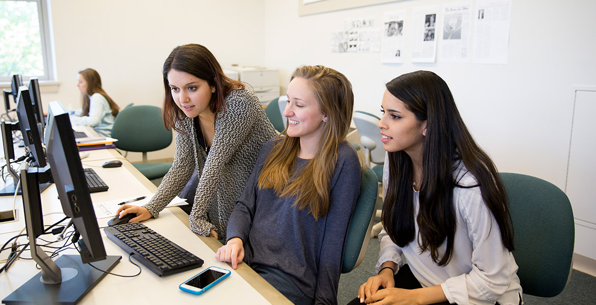 Brown and White newspaper students editing