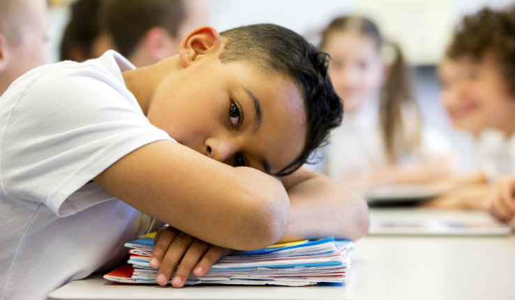 Student with head on desk