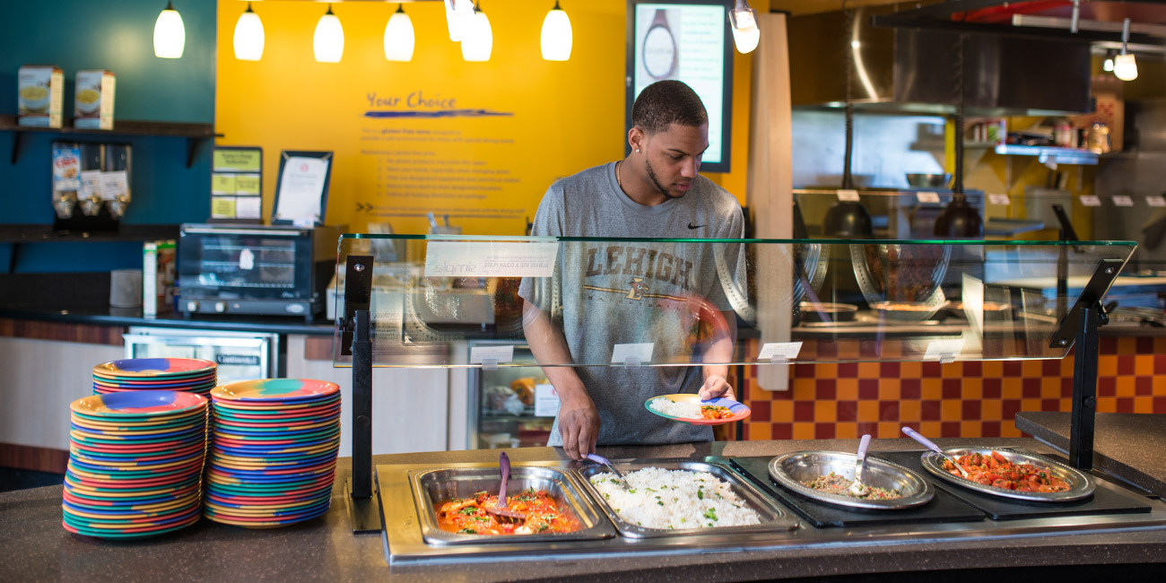 Student serving himself at buffet