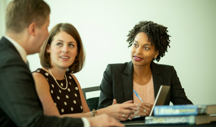 Graduate students at a table