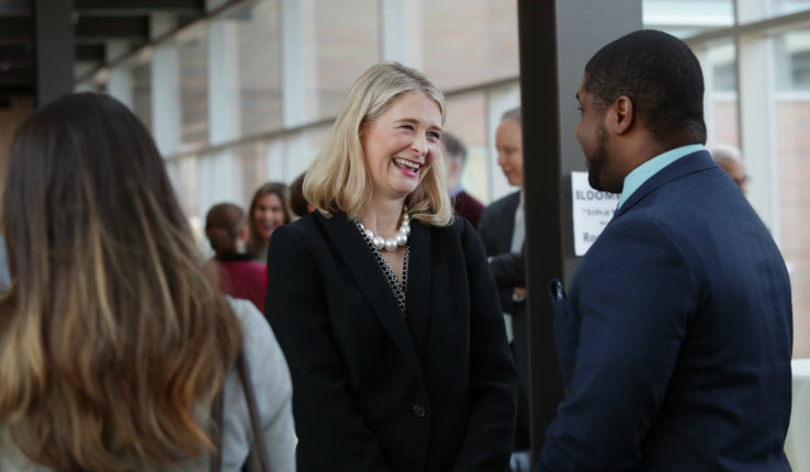 Dean Whitney P. Witt speaks to guest at welcome reception. 