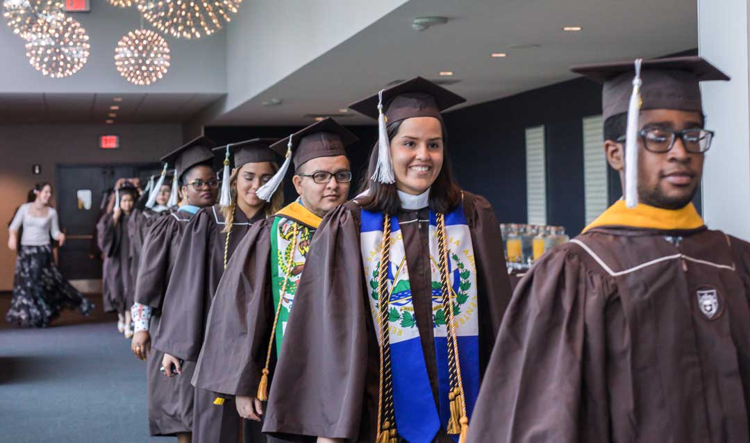 Lehigh graduates process into the Donning of the Kente ceremony