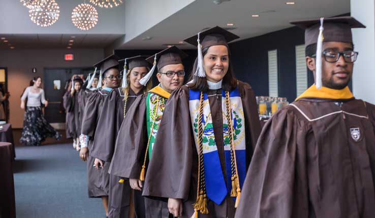 Lehigh graduates process into the Donning of the Kente ceremony