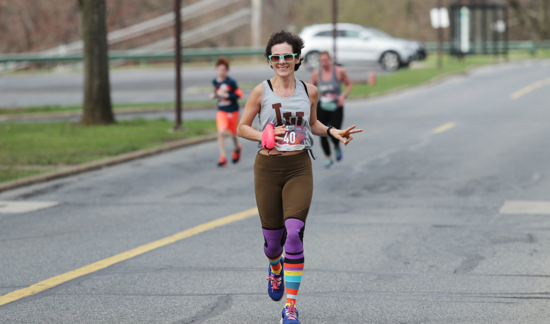 Woman running in Lehigh graduate student 5K