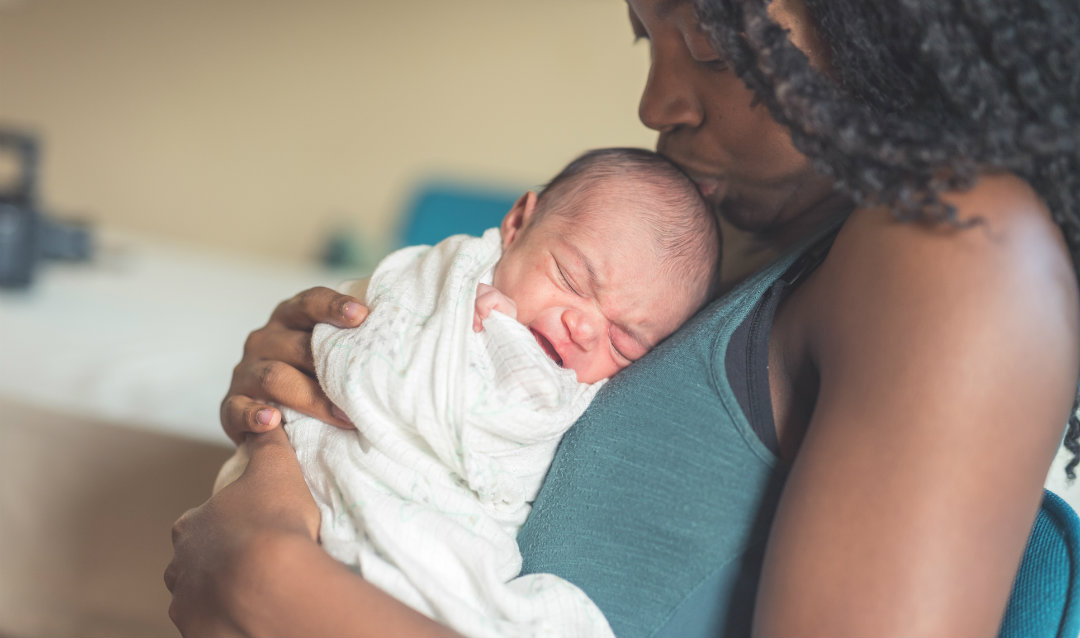 A mother comforts her child.