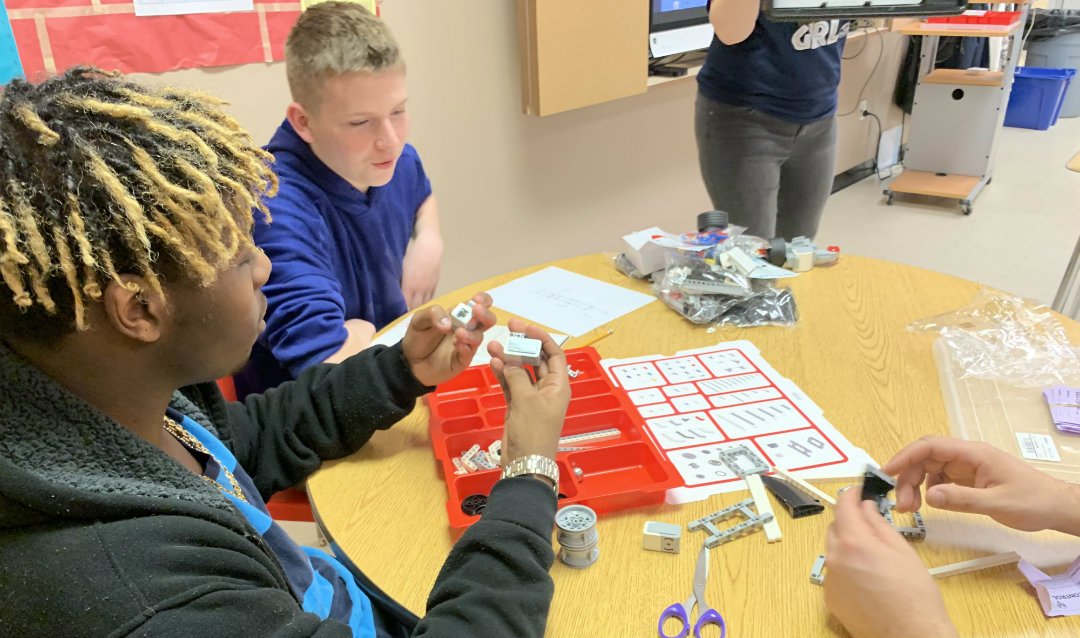 Students at Centennial School of Lehigh University organize the EV3 Mindstorm set materials.