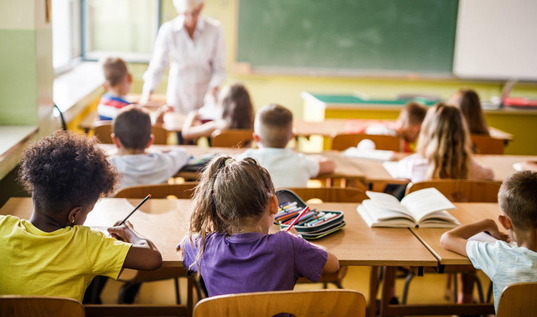 Children work in a classroom