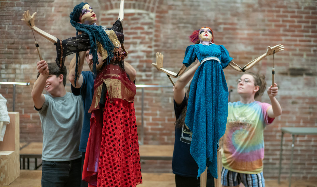 Actors and actresses in a rehearsal for The Secret