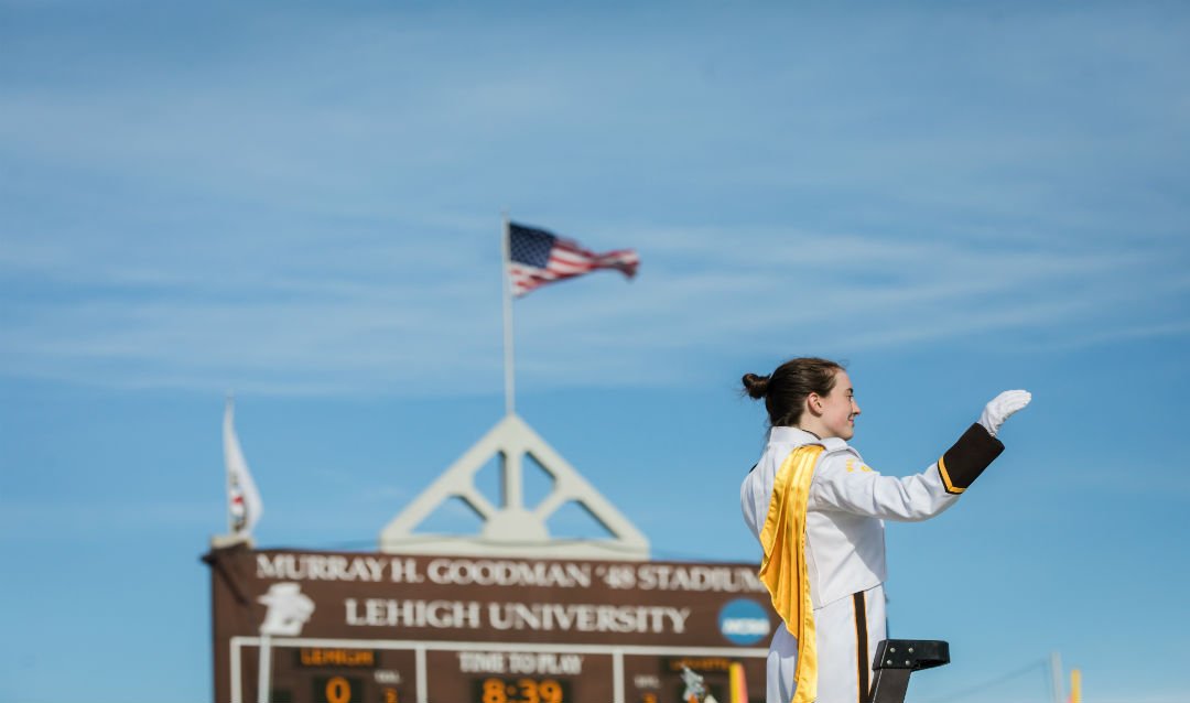 The Marching 97's drum major directs the band at halftime.