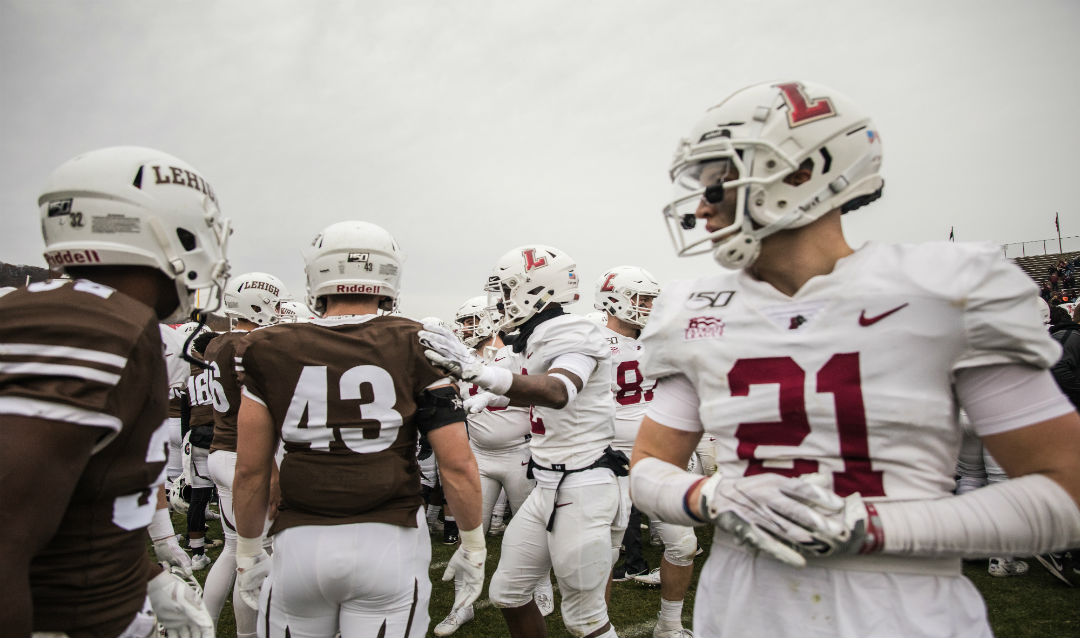 Lehigh and Lafayette players mingle on the field after the Leopards' victory.