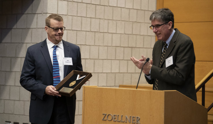 Flowers receives the Lehigh medallion from Farrell