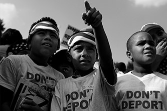 Immigrant children with tshirts reading "don't deport."