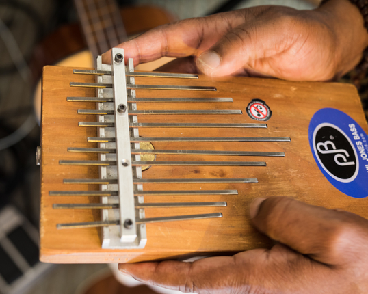 Kumalo demonnstrates a kalimba