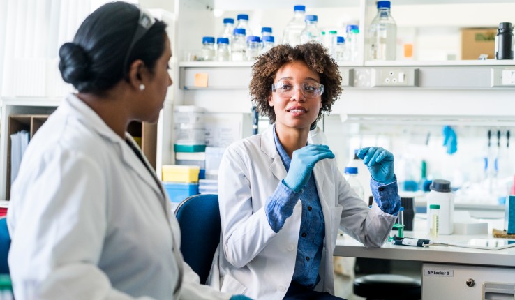 Two women scientists talking