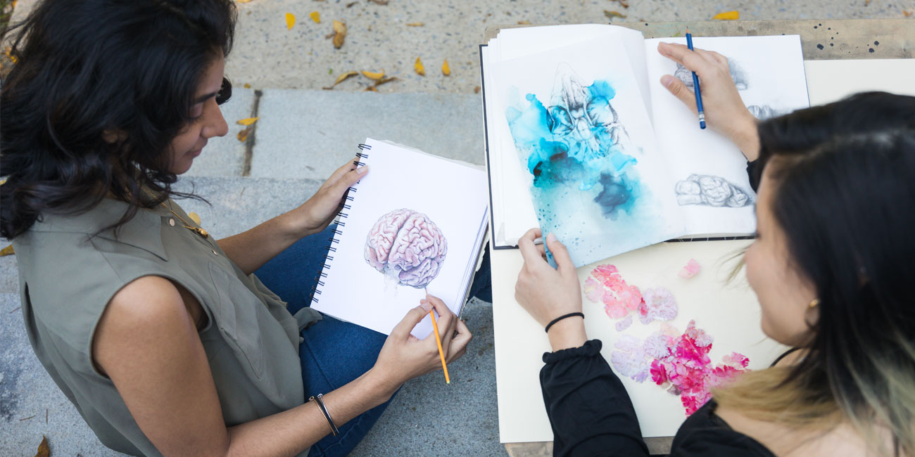 Sarrah Hussain and Viola Yu show their illustrations