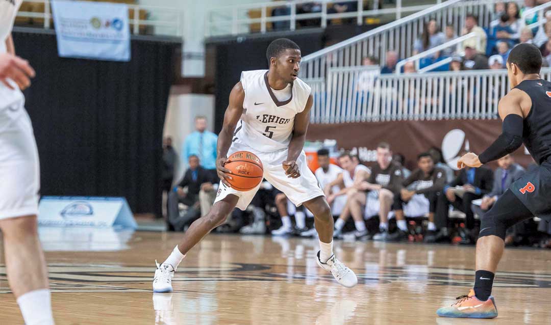 Austin Price playing basketball at Lehigh