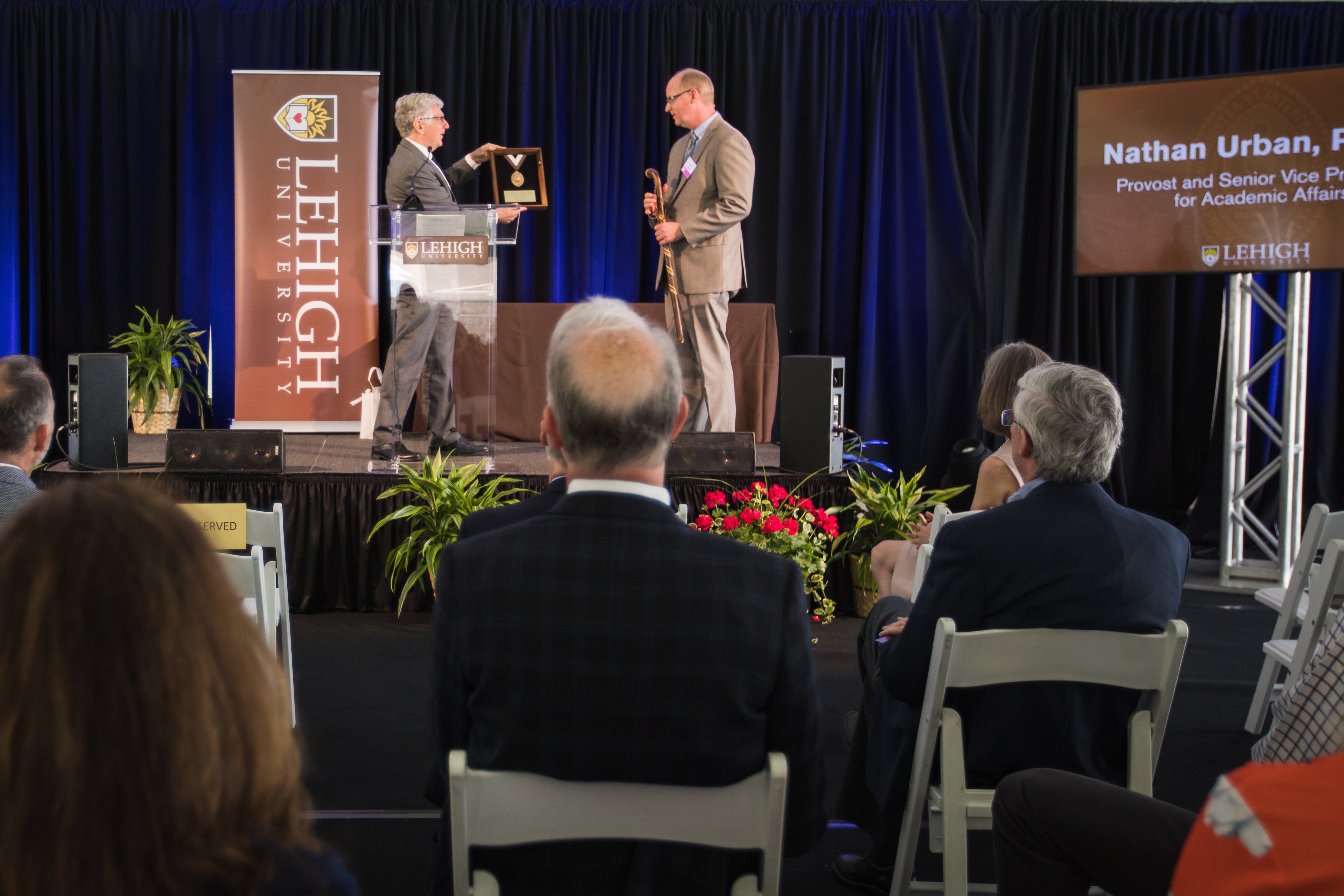 President Simon presents Provost Urban with Lehigh medallion