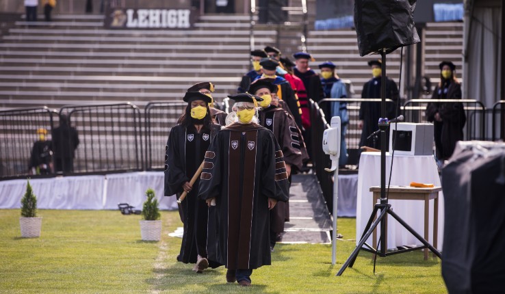 Faculty members leaving the Commencement stage