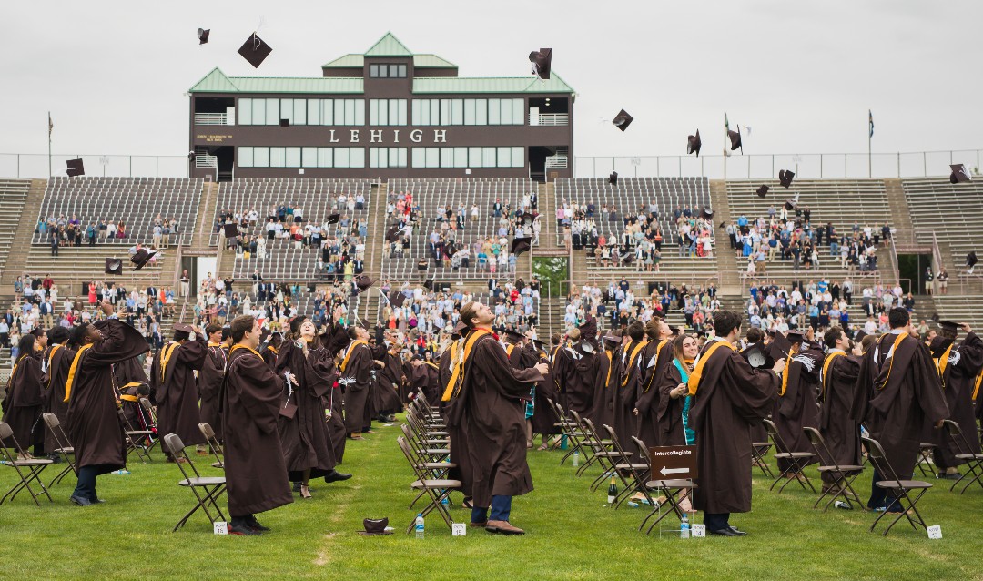 grads toss up their motarboards