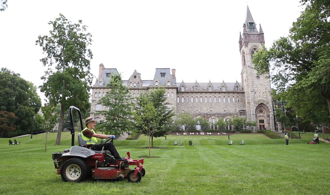 Simon drives a riding lawn mower