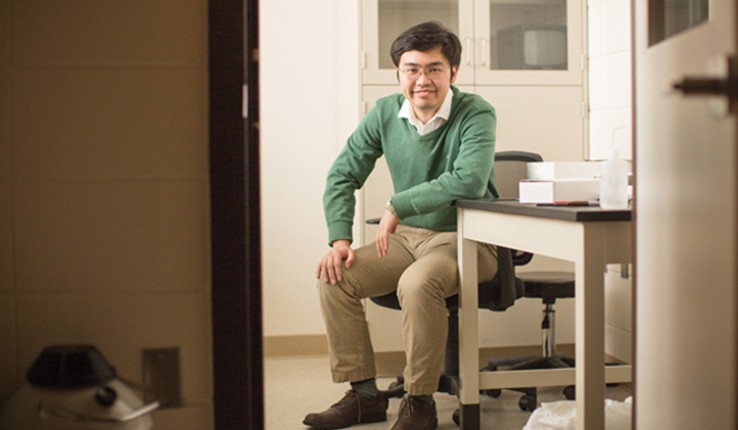 Xiaoji Xu sitting at a table