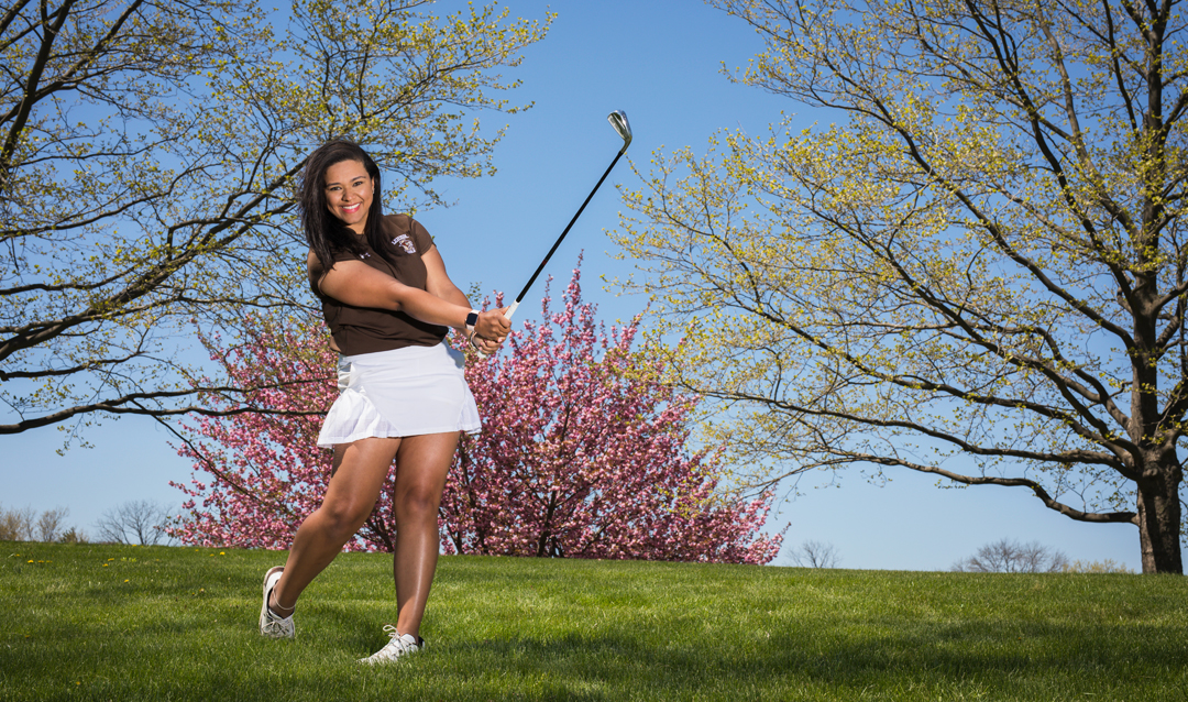 Hannah Foster following through on a golf shot