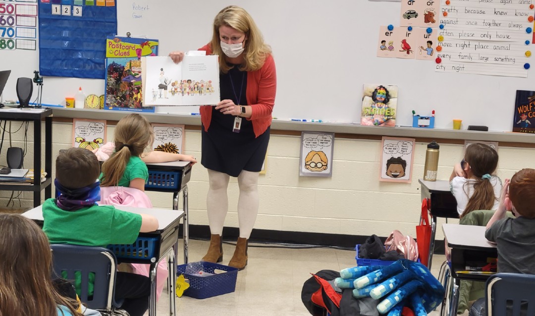 Bridget O'Connell reading to students