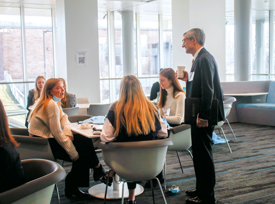 Joseph Helble with students at Women in Business Conference