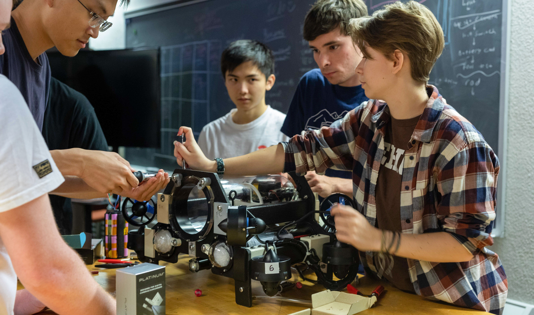 Students working on Autonomous Driving for Underwater Drones project vehicle