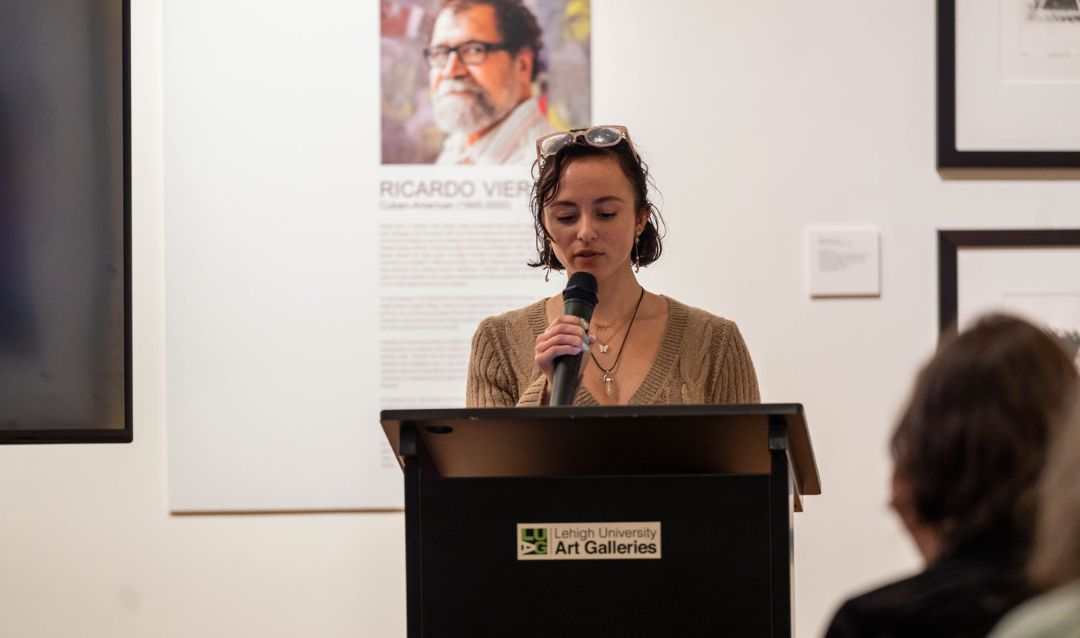 Woman reading poetry at a podium