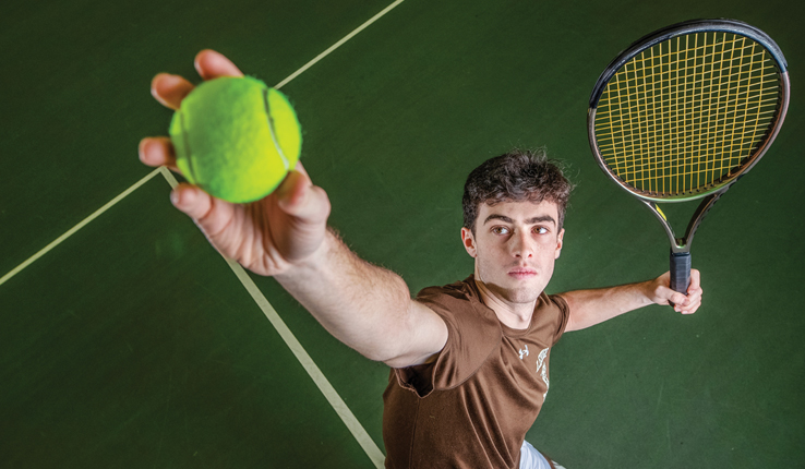 Marc Blekhman serving tennis ball