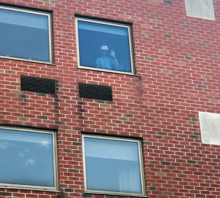 Nic Altenderfer at the window of his room in Good Shepherd Rehabilitation Center