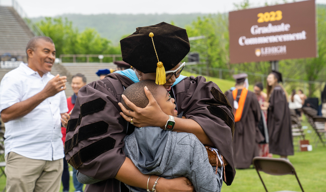 Kadia Nichelle Hylton-Fraser ’23G and her son