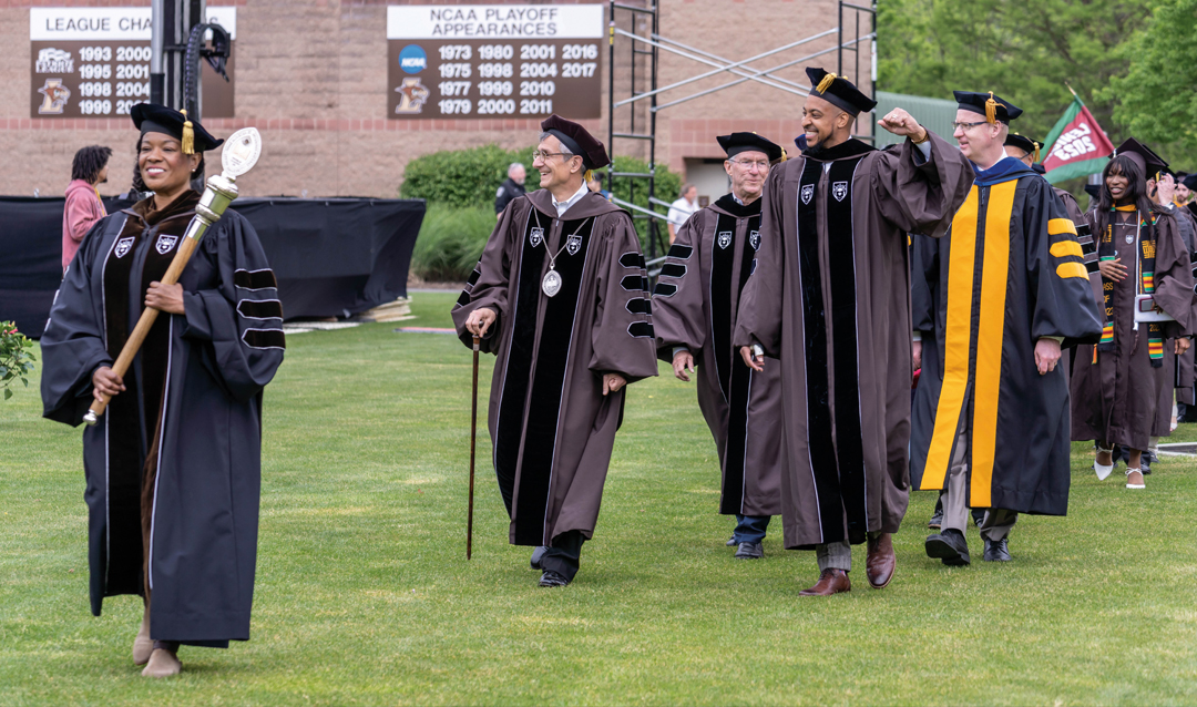 President Joseph J. Helble ’82 and C.J. McCollum ’13