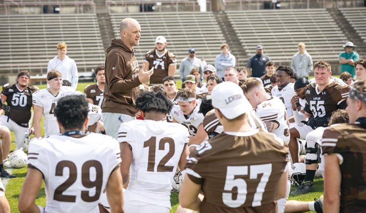 Kevin Cahill talks to Lehigh football team huddle