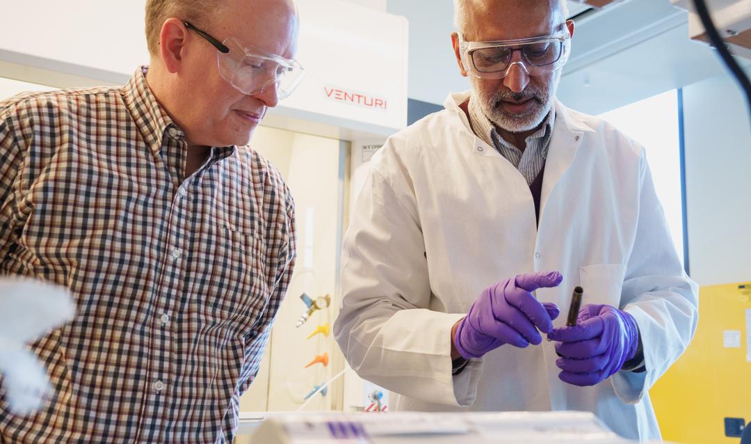 Brian Davison and Anand Jagota working in lab