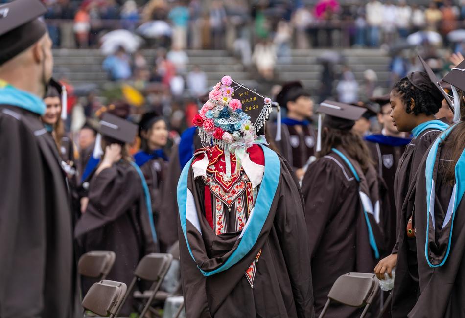 graduate with decorative mortarboard