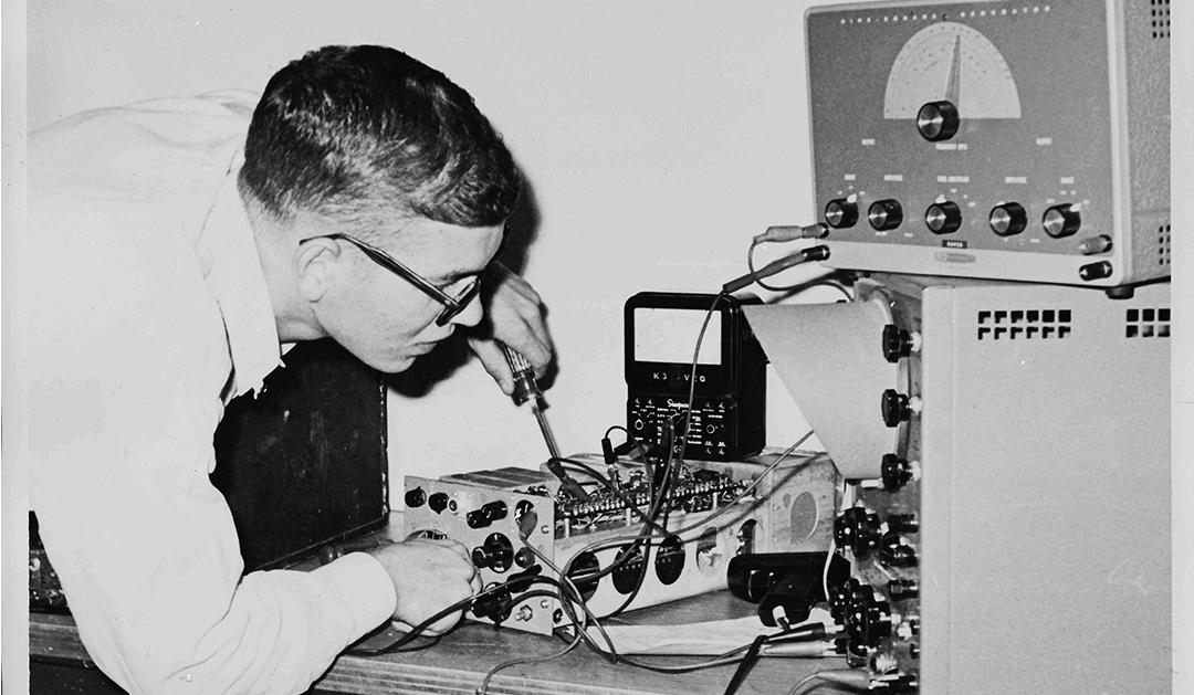 student working on a ham radio