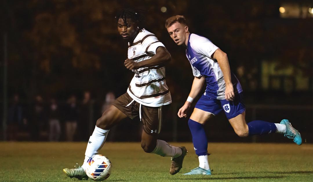 Perry Kingson possessing a soccer ball in a match