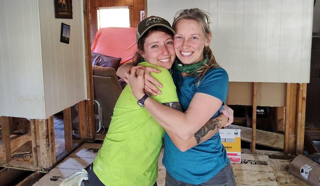 Katie Gregory ’15 and Ashley Kreitz ’15 share a hug while working on restoring a home in Barnardsville, North Carolina that was damaged by Hurricane Helene.