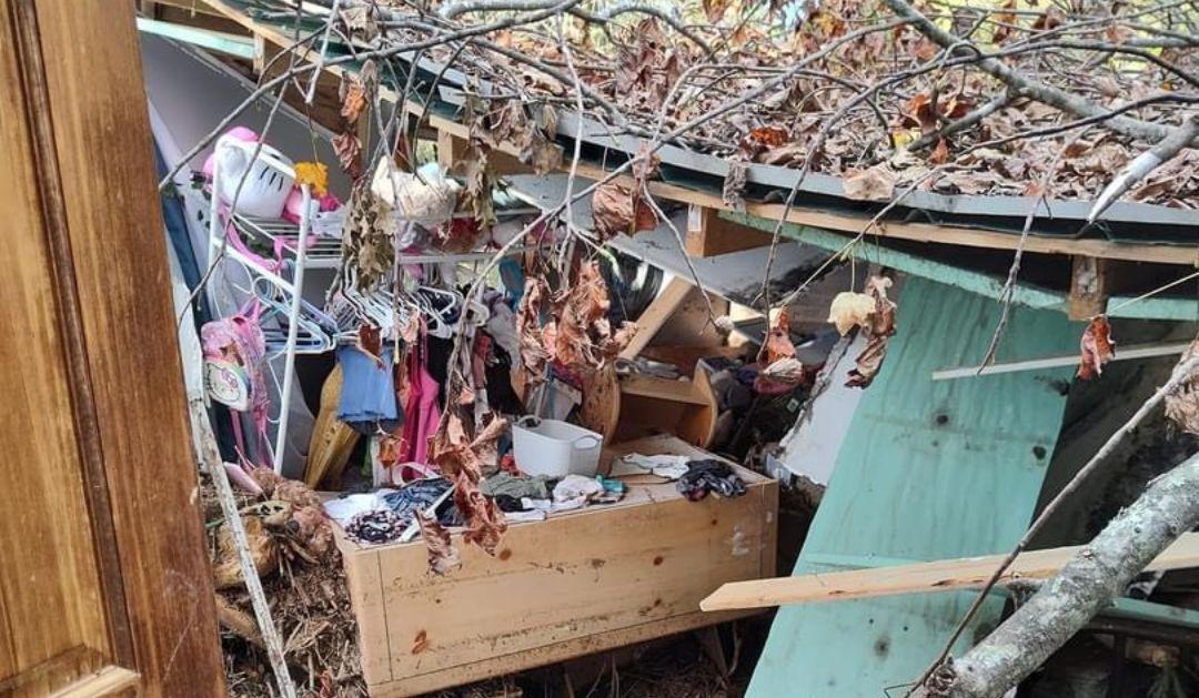 A mobile home in Barnardsville, North Carolina was left collapsed and broken in half from Hurricane Helene flood waters.