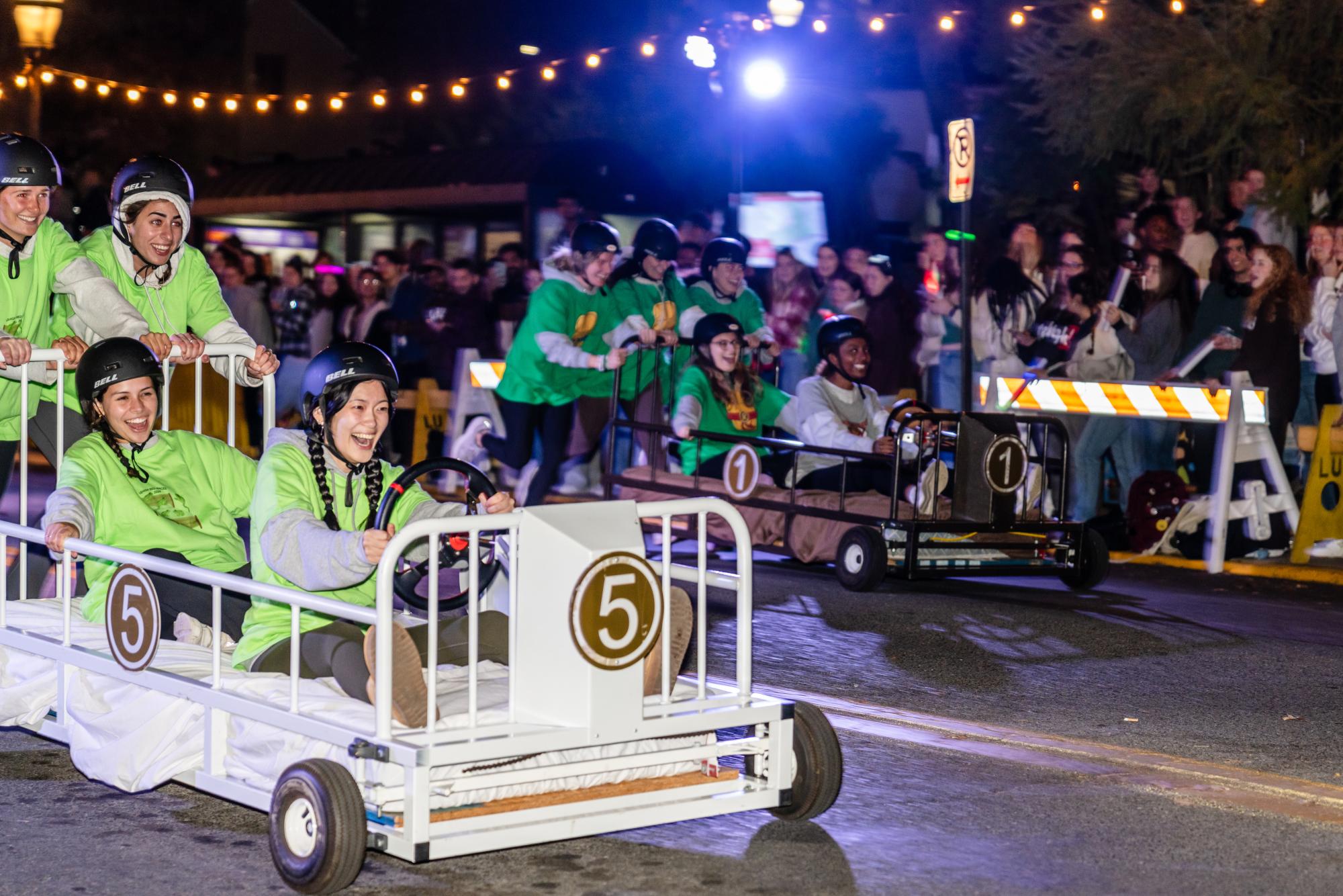 Students compete in a bed race