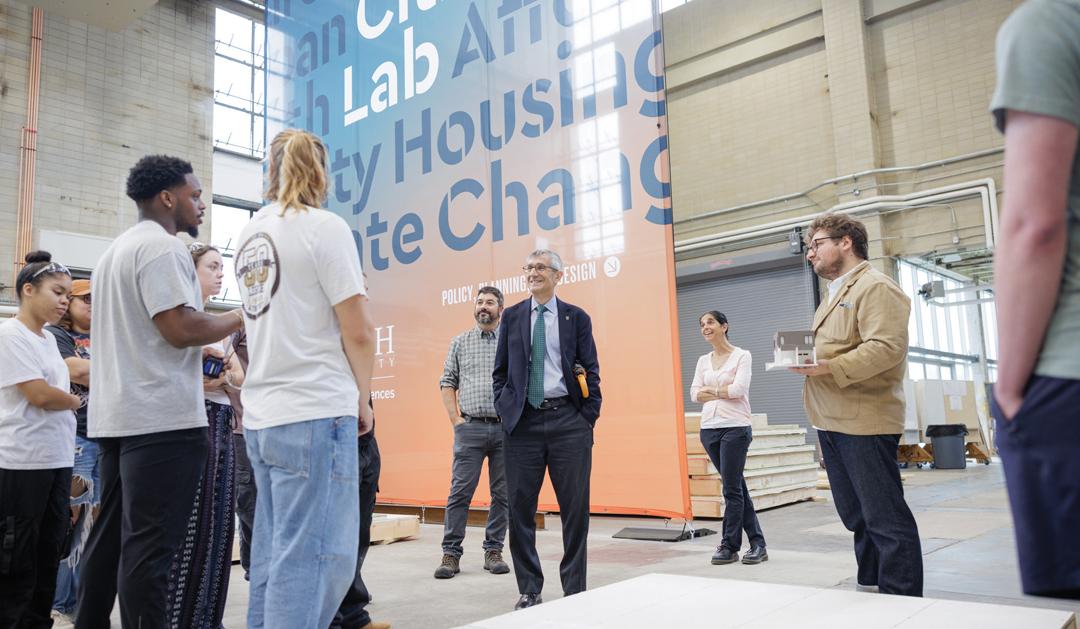 President Joseph J. Helble ’82 visits with the Alley House Team at Building C on the Mountaintop Campus. 