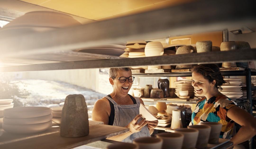 two people smiling at work