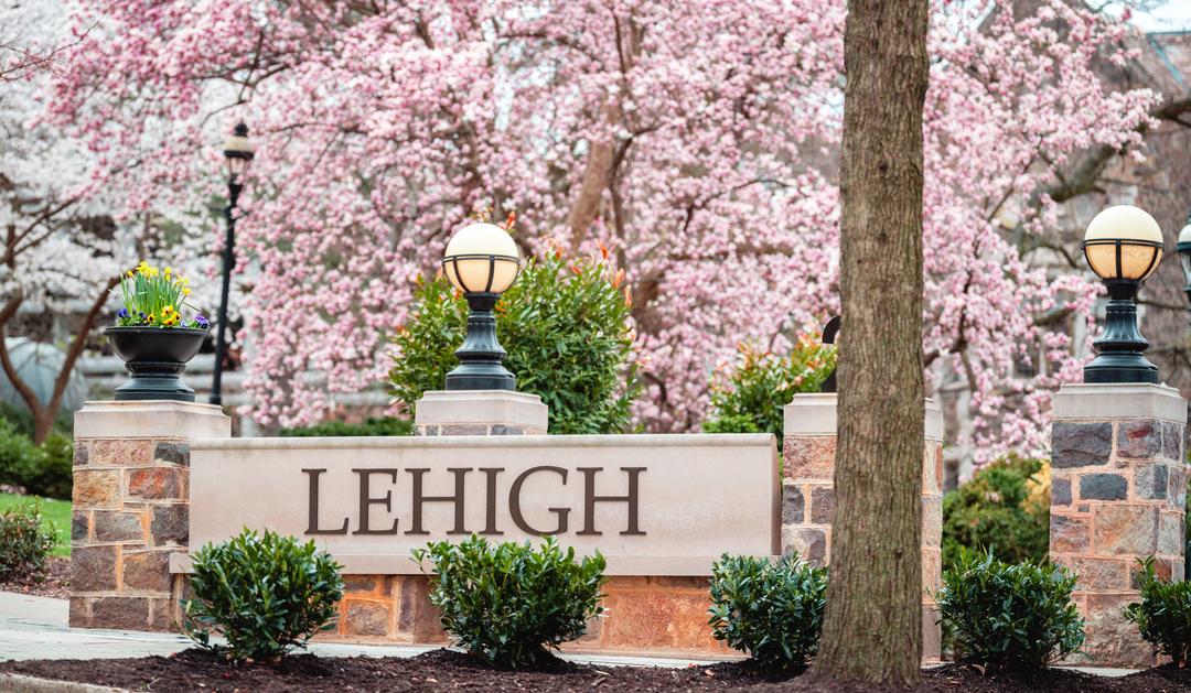 Lehigh University sign surrounded by pink blossoms