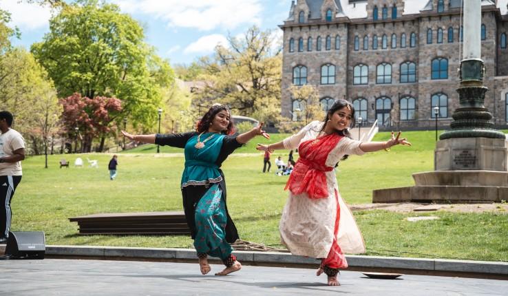 Dancers on stage on UC lawn
