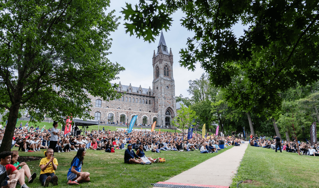 Students on lawn for orientation