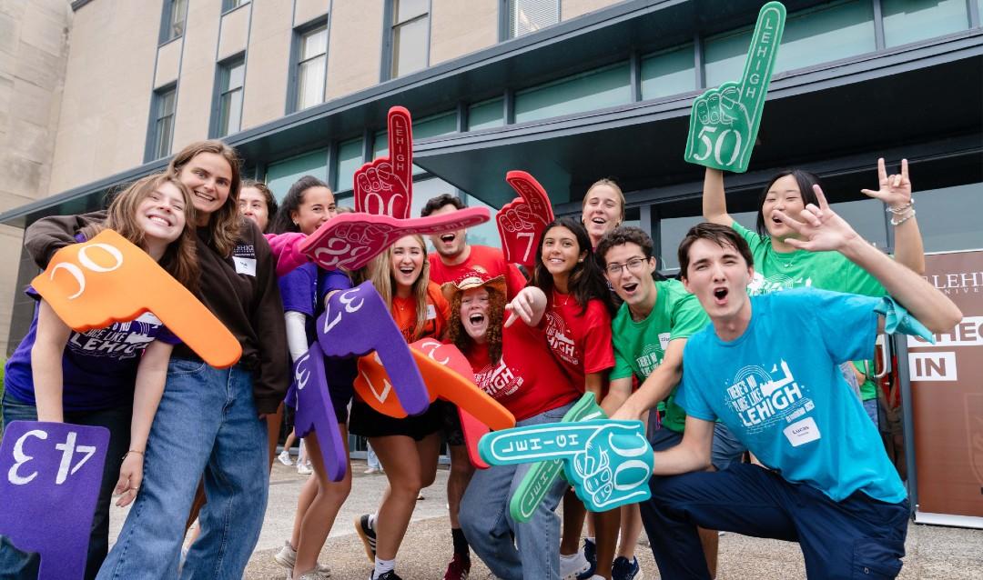 Volunteers posing for photo before assisting with move-in
